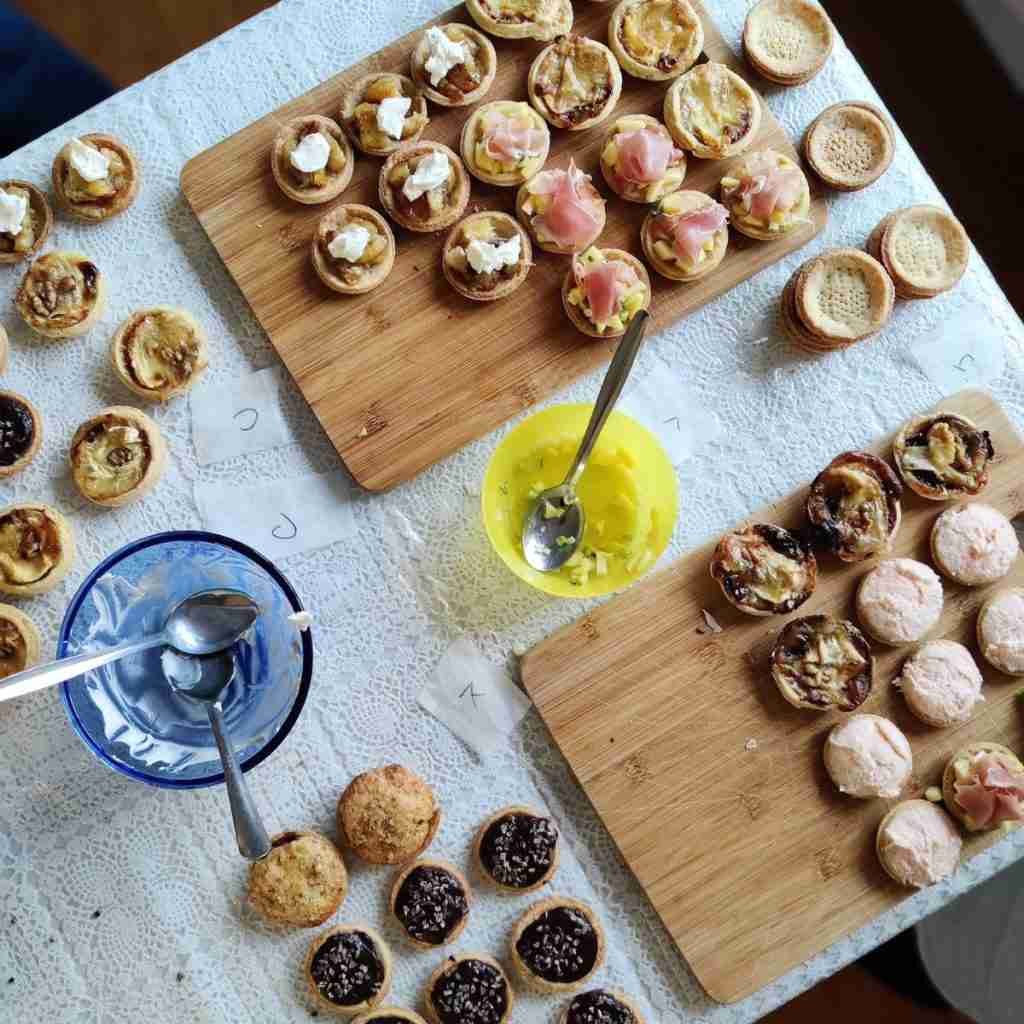 image of selection of tartelettes filled with salmon mousse, chutney, ganache and frangipane